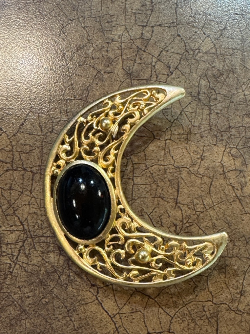 Gold Crescent Moon Brooch with Black Stone
